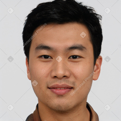 Joyful asian young-adult male with short  black hair and brown eyes