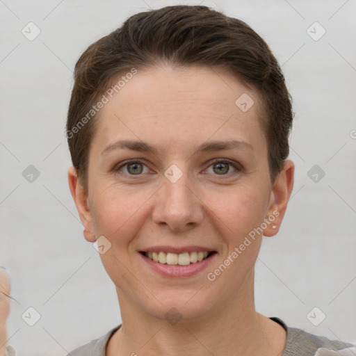 Joyful white young-adult female with short  brown hair and grey eyes