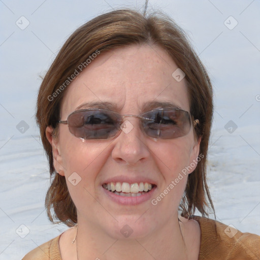 Joyful white adult female with medium  brown hair and blue eyes