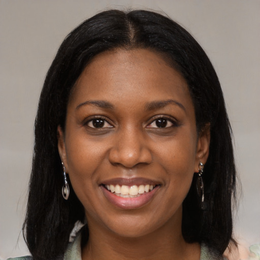 Joyful black young-adult female with medium  black hair and brown eyes