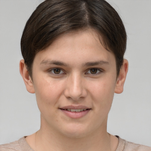 Joyful white young-adult female with short  brown hair and grey eyes