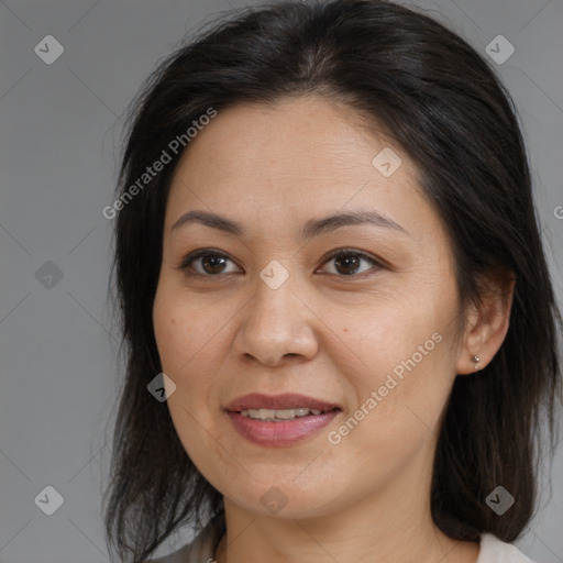 Joyful white adult female with medium  brown hair and brown eyes