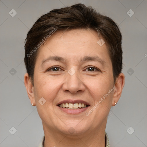 Joyful white adult female with short  brown hair and brown eyes