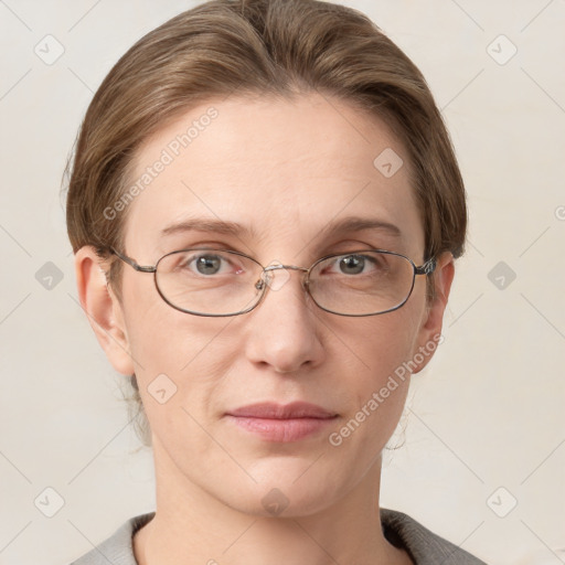 Joyful white adult female with medium  brown hair and grey eyes