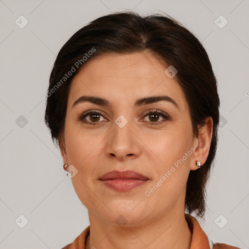 Joyful white adult female with medium  brown hair and brown eyes