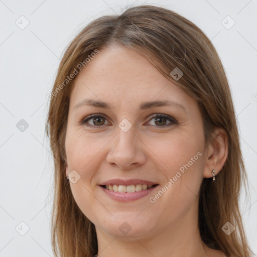 Joyful white young-adult female with long  brown hair and brown eyes