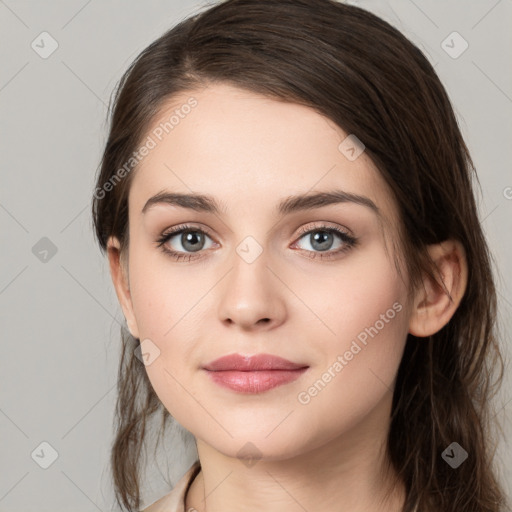 Neutral white young-adult female with long  brown hair and brown eyes