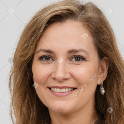 Joyful white adult female with long  brown hair and brown eyes