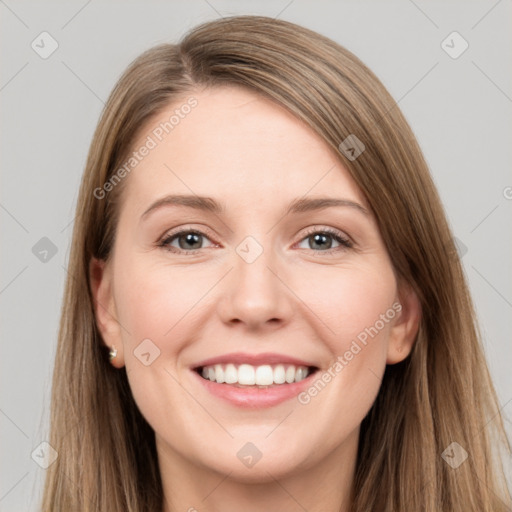 Joyful white young-adult female with long  brown hair and grey eyes