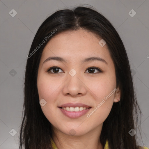 Joyful asian young-adult female with long  brown hair and brown eyes