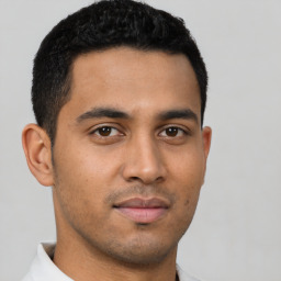 Neutral latino young-adult male with short  brown hair and brown eyes