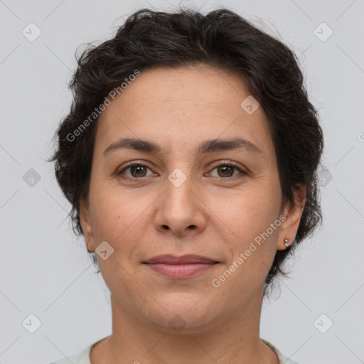 Joyful white adult female with short  brown hair and brown eyes