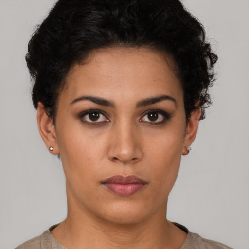 Neutral latino young-adult female with short  brown hair and brown eyes