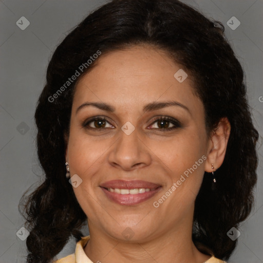 Joyful latino adult female with medium  brown hair and brown eyes