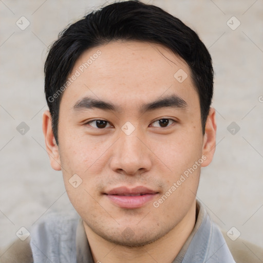 Joyful asian young-adult male with short  black hair and brown eyes