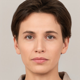 Neutral white young-adult female with short  brown hair and brown eyes