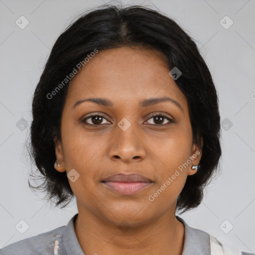 Joyful black young-adult female with medium  brown hair and brown eyes