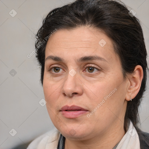 Joyful white adult female with medium  brown hair and brown eyes