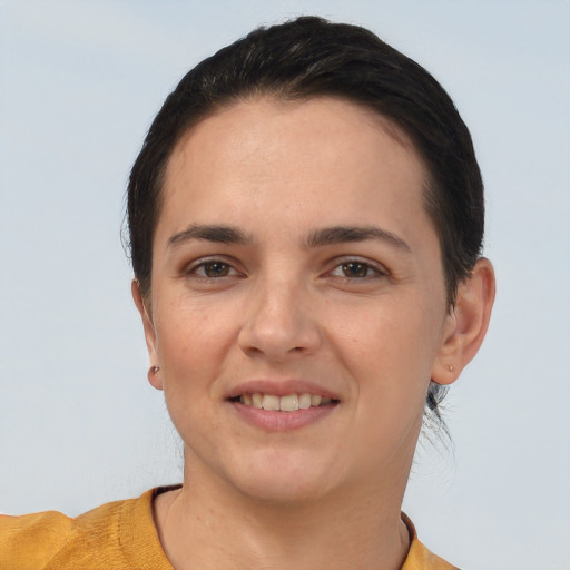 Joyful white young-adult female with short  brown hair and brown eyes