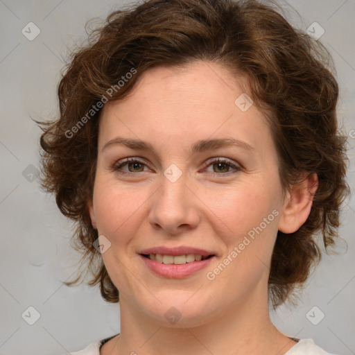 Joyful white young-adult female with medium  brown hair and green eyes