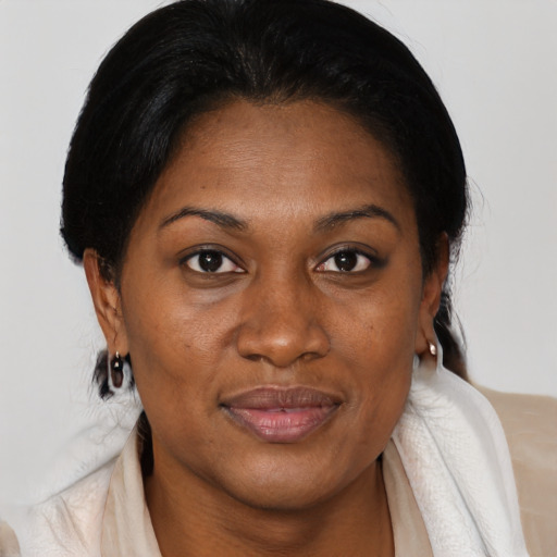 Joyful black young-adult female with medium  brown hair and brown eyes