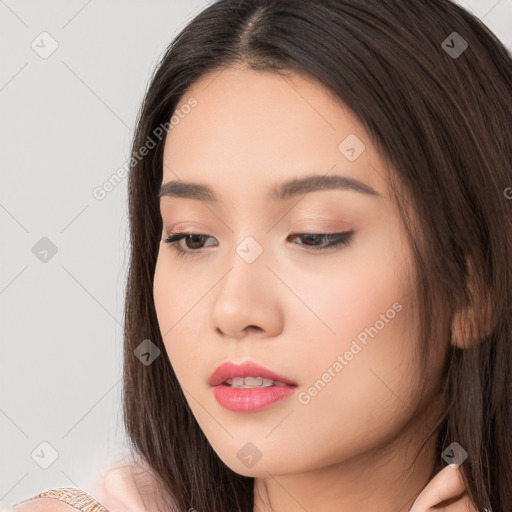 Neutral white young-adult female with long  brown hair and brown eyes