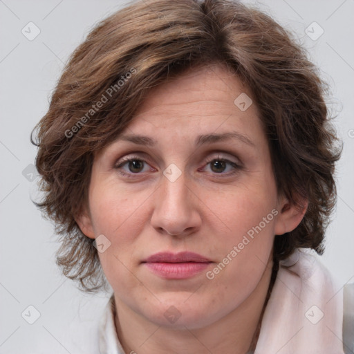 Joyful white adult female with medium  brown hair and blue eyes