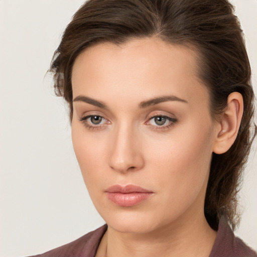 Neutral white young-adult female with long  brown hair and brown eyes