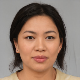 Joyful asian young-adult female with medium  brown hair and brown eyes