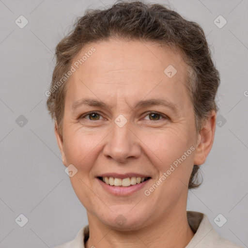 Joyful white adult female with short  brown hair and brown eyes