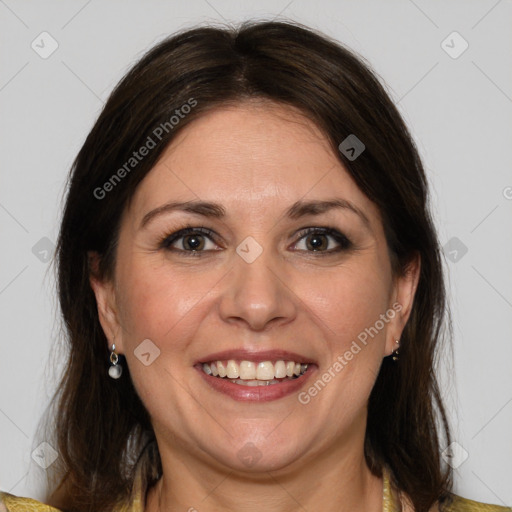 Joyful white adult female with medium  brown hair and grey eyes