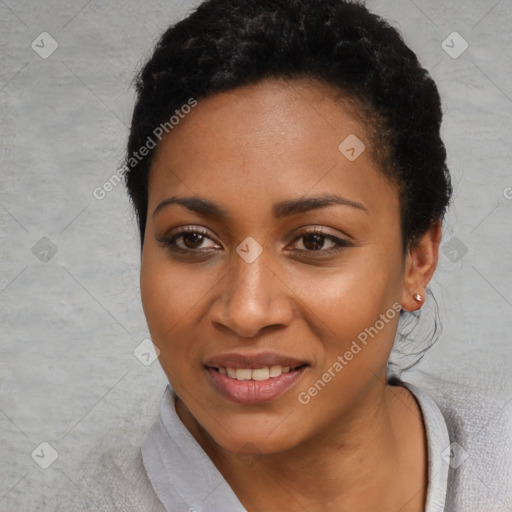 Joyful black young-adult female with short  black hair and brown eyes