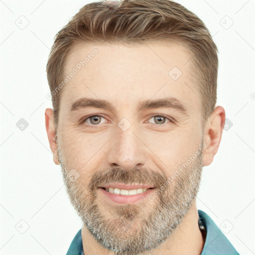 Joyful white adult male with short  brown hair and brown eyes