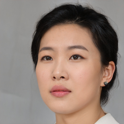 Neutral asian young-adult female with medium  brown hair and brown eyes