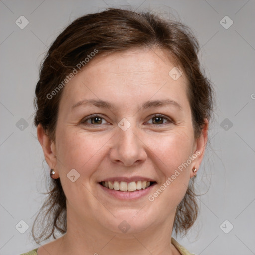 Joyful white adult female with medium  brown hair and grey eyes