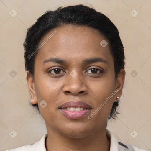 Joyful black young-adult female with short  black hair and brown eyes