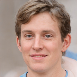 Joyful white adult male with short  brown hair and grey eyes