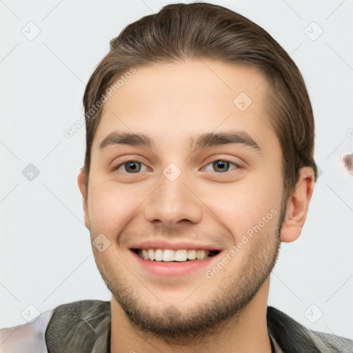 Joyful white young-adult male with short  brown hair and brown eyes