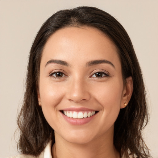 Joyful white young-adult female with medium  brown hair and brown eyes