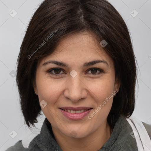 Joyful white adult female with medium  brown hair and brown eyes