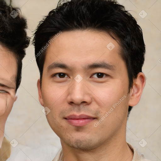 Joyful asian young-adult male with short  brown hair and brown eyes