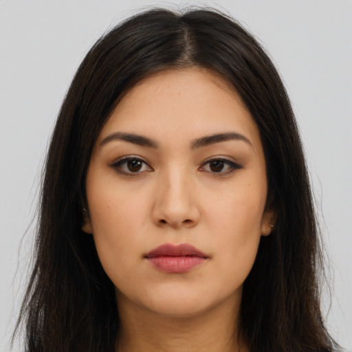 Neutral latino young-adult female with long  brown hair and brown eyes