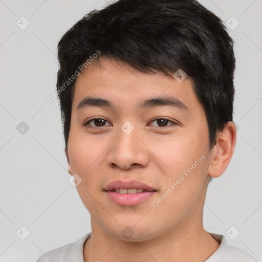 Joyful asian young-adult male with short  brown hair and brown eyes