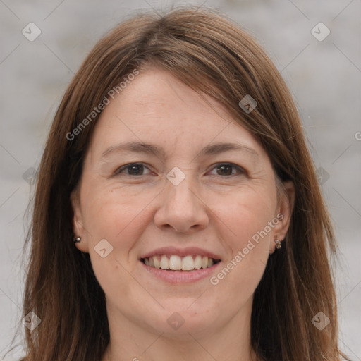 Joyful white adult female with medium  brown hair and brown eyes