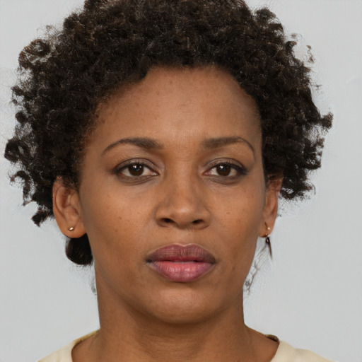 Neutral black young-adult female with short  brown hair and brown eyes