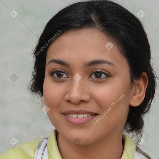 Joyful latino young-adult female with medium  brown hair and brown eyes