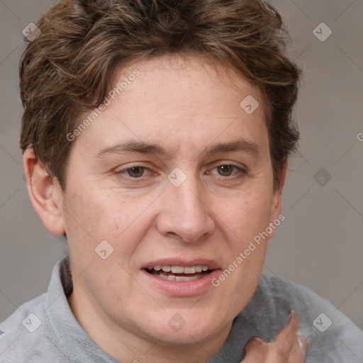 Joyful white adult female with short  brown hair and grey eyes