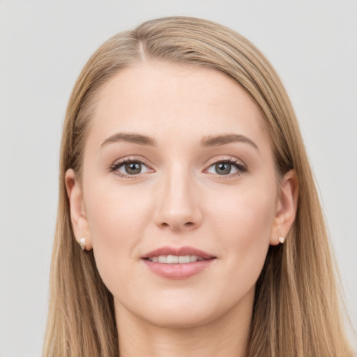 Joyful white young-adult female with long  brown hair and grey eyes