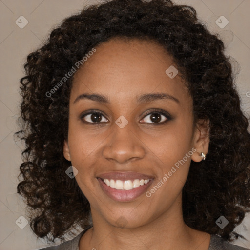 Joyful black young-adult female with medium  brown hair and brown eyes