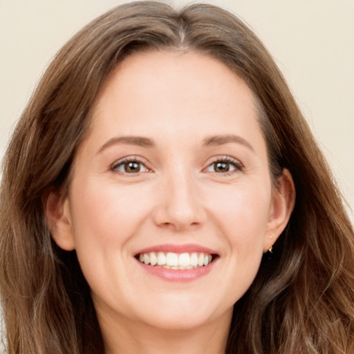 Joyful white young-adult female with long  brown hair and grey eyes